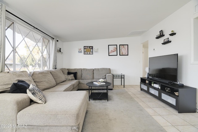 living area with light tile patterned floors