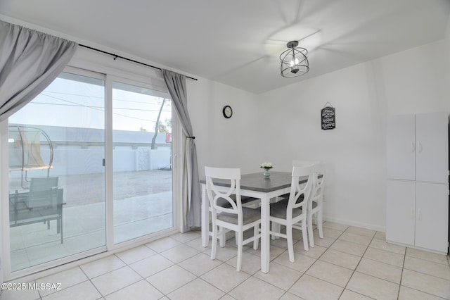 unfurnished dining area with light tile patterned floors