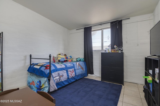 bedroom featuring tile patterned flooring