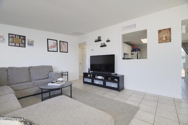 living room with visible vents and tile patterned flooring