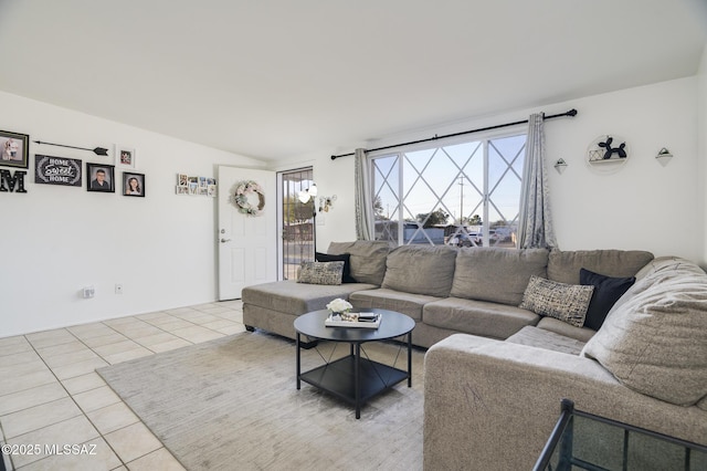 tiled living room featuring lofted ceiling