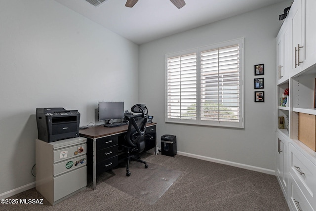office space featuring baseboards, carpet floors, ceiling fan, and visible vents