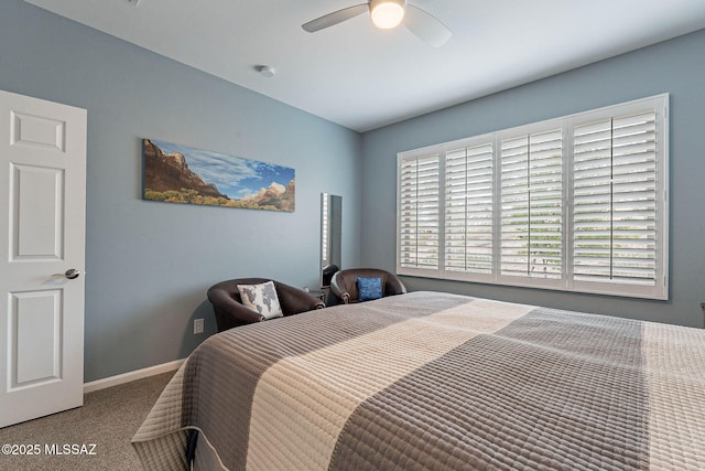 bedroom featuring baseboards, carpet floors, and a ceiling fan
