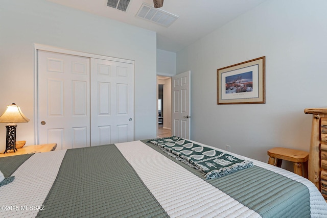 bedroom featuring a closet and visible vents