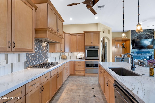 39425 S Mchaney Ct, Tucson, AZ 85739 - kitchen featuring a sink, tasteful backsplash, stainless steel appliances, visible vents, and ceiling fan