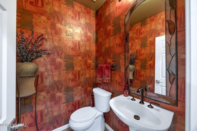 39425 S Mchaney Ct, Tucson, AZ 85739 - half bath featuring toilet, a sink, and wallpapered walls