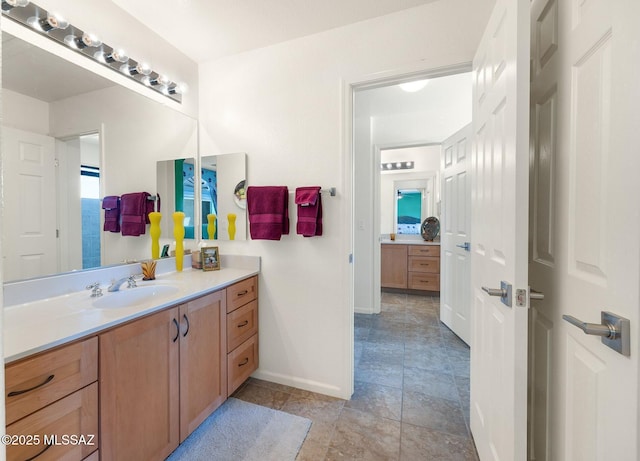 39425 S Mchaney Ct, Tucson, AZ 85739 - bathroom featuring baseboards and vanity
