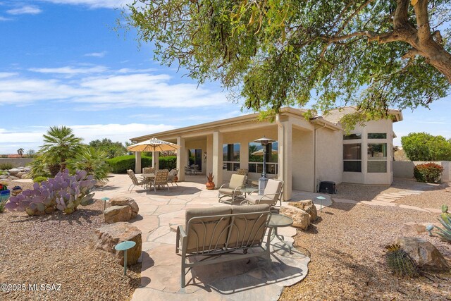 39425 S Mchaney Ct, Tucson, AZ 85739 - back of property with stucco siding and a patio