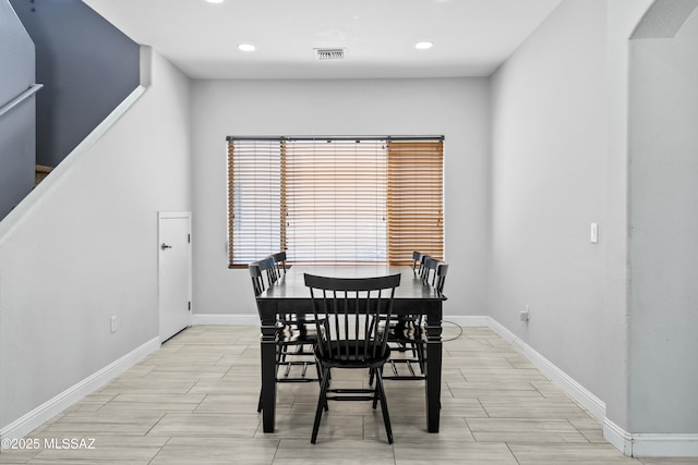 dining room with baseboards, visible vents, and recessed lighting
