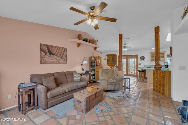 living room featuring lofted ceiling, visible vents, and ceiling fan