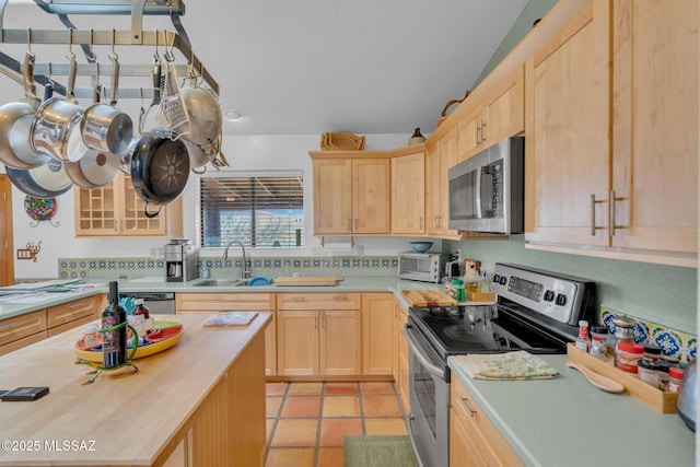 kitchen featuring light brown cabinets, a sink, wooden counters, and appliances with stainless steel finishes