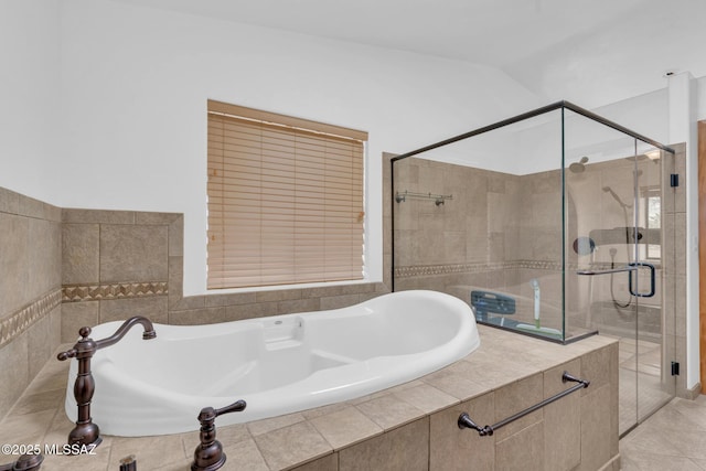 bathroom featuring a garden tub and a stall shower