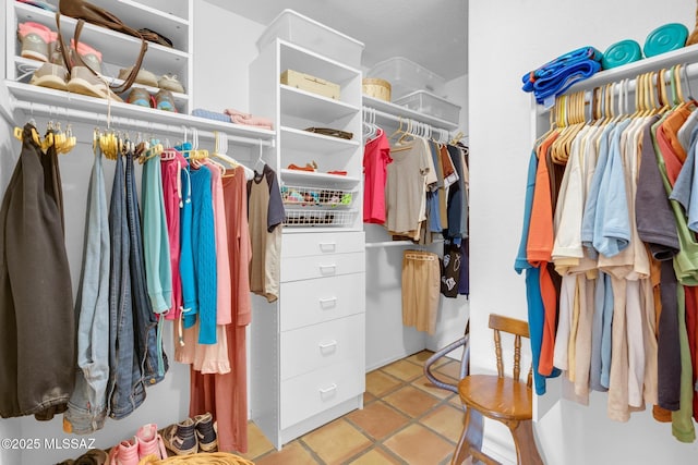 spacious closet featuring tile patterned floors