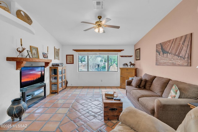 living room featuring vaulted ceiling, visible vents, ceiling fan, and light tile patterned floors