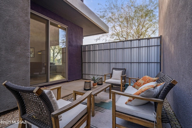 view of patio / terrace with an outdoor hangout area and fence