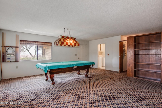 rec room with carpet flooring, billiards, washer and dryer, and a textured ceiling