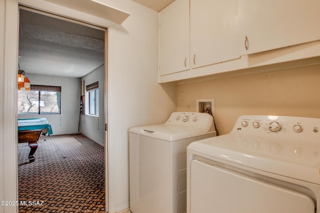 laundry room with washing machine and dryer, a textured ceiling, billiards, light colored carpet, and cabinet space