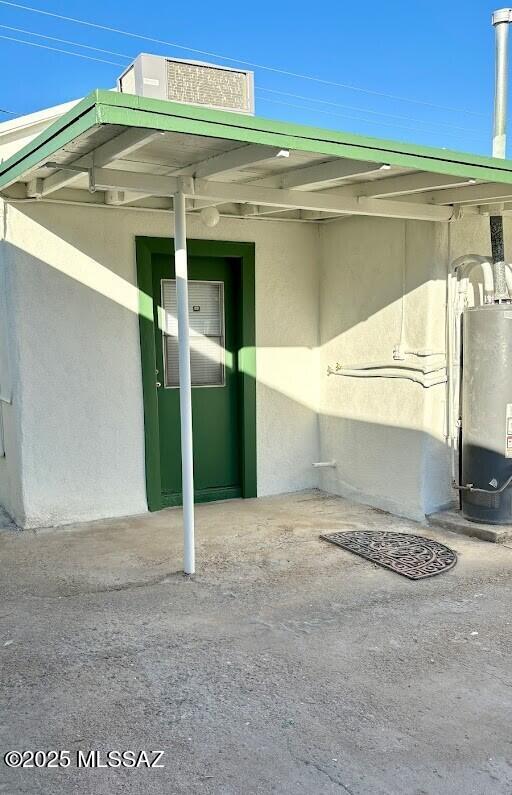 view of car parking with water heater