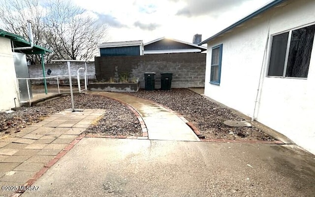 view of yard featuring a patio and fence