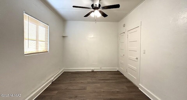 unfurnished room with dark wood-style flooring, baseboards, and ceiling fan