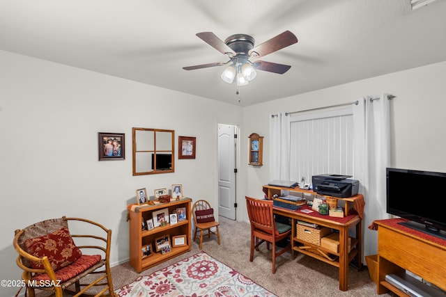 carpeted office with ceiling fan