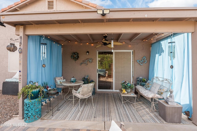 wooden terrace featuring a ceiling fan