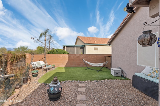view of yard with a fenced backyard
