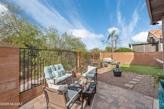 view of patio with a fenced backyard and an outdoor hangout area