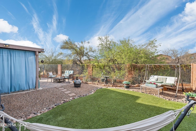 view of yard with a patio, a fenced backyard, and an outdoor hangout area