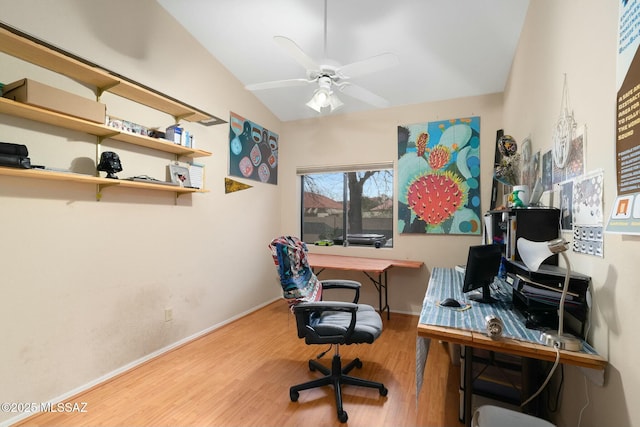 office featuring baseboards, wood finished floors, a ceiling fan, and lofted ceiling