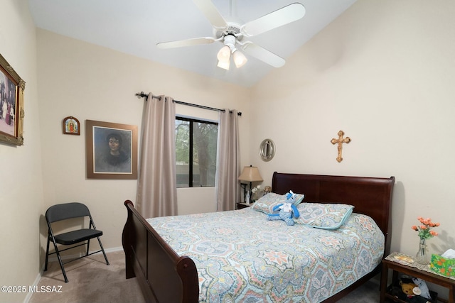carpeted bedroom with baseboards, a ceiling fan, and vaulted ceiling