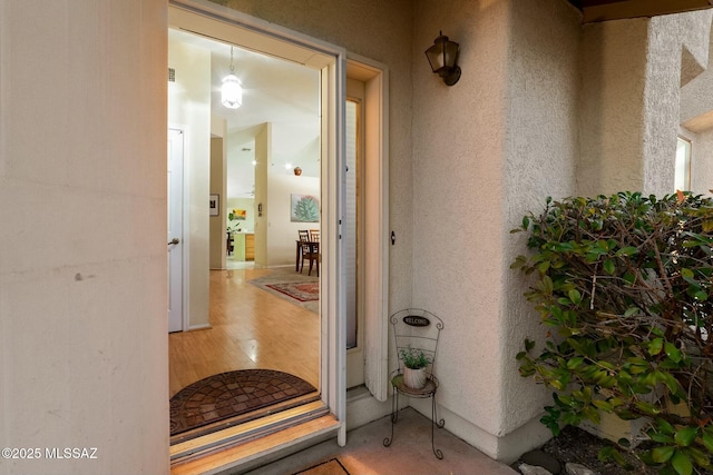 view of exterior entry with stucco siding