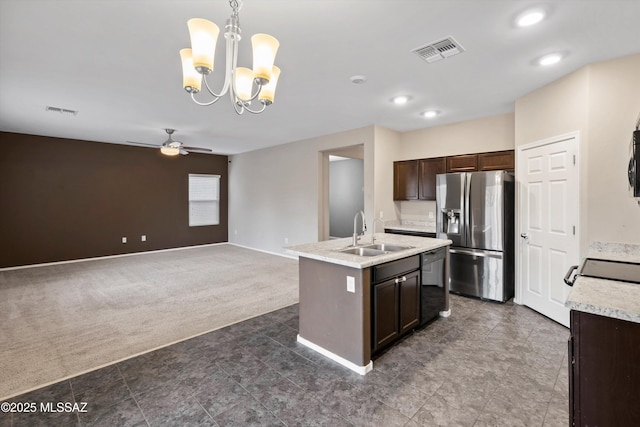 12272 W Reyher Farms Loop, Marana, AZ 85653 - kitchen with stainless steel fridge with ice dispenser, black dishwasher, dark carpet, dark brown cabinetry, and light countertops