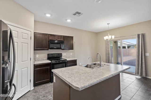12272 W Reyher Farms Loop, Marana, AZ 85653 - kitchen featuring black appliances, dark brown cabinets, a chandelier, pendant lighting, and light countertops