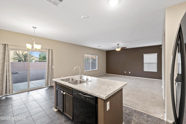 12272 W Reyher Farms Loop, Marana, AZ 85653 - kitchen with black dishwasher, a chandelier, light countertops, ceiling fan, and pendant lighting