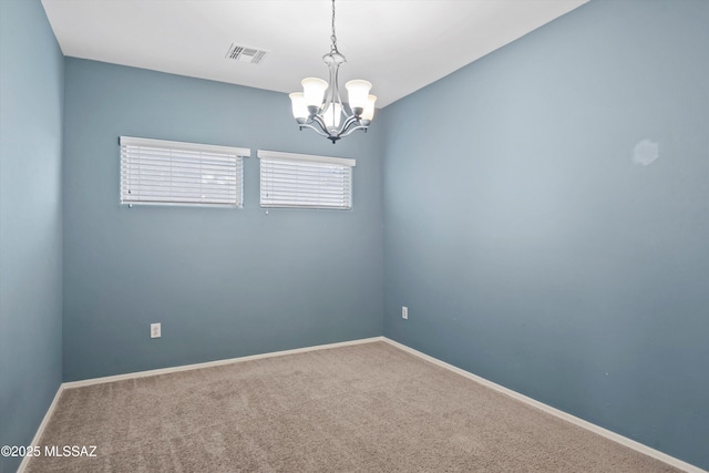 12272 W Reyher Farms Loop, Marana, AZ 85653 - carpeted spare room with a chandelier and baseboards