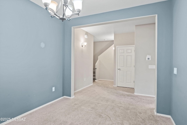 12272 W Reyher Farms Loop, Marana, AZ 85653 - carpeted empty room with a chandelier and baseboards
