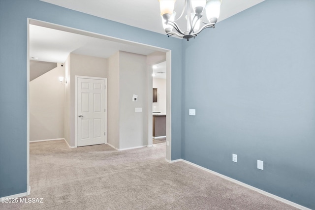 12272 W Reyher Farms Loop, Marana, AZ 85653 - spare room featuring a chandelier and carpet