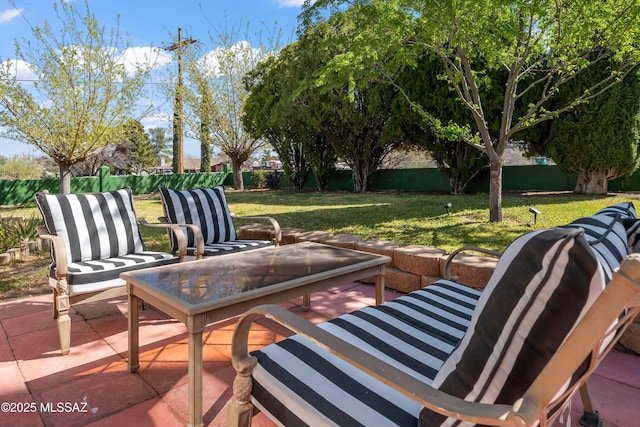 view of patio / terrace featuring fence