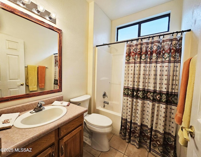 full bathroom featuring toilet, tile patterned floors, vanity, shower / tub combo, and a textured wall
