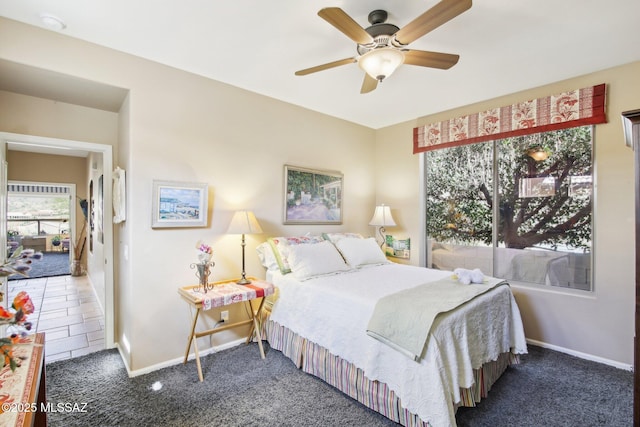 carpeted bedroom featuring ceiling fan and baseboards
