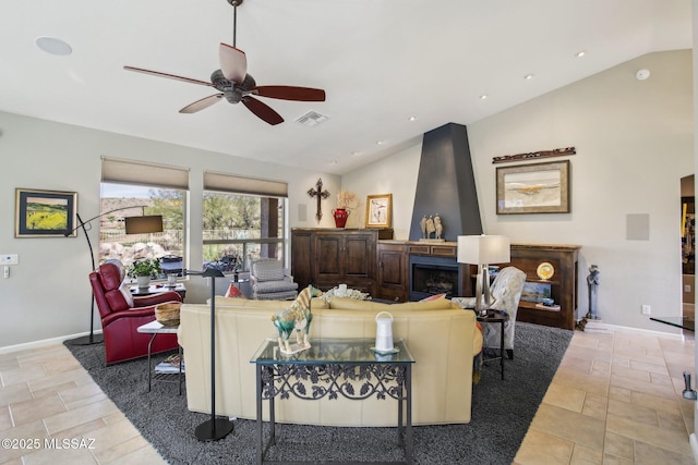 living room featuring a fireplace, ceiling fan, visible vents, baseboards, and lofted ceiling