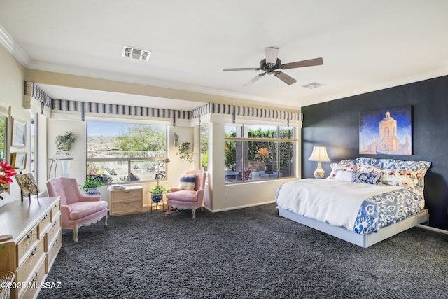 carpeted bedroom with baseboards, visible vents, ornamental molding, and ceiling fan