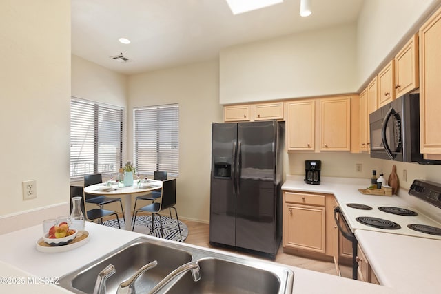 kitchen with visible vents, light brown cabinets, range with electric cooktop, black microwave, and fridge with ice dispenser
