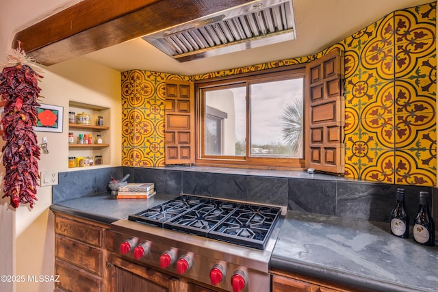 kitchen with stainless steel gas stovetop, built in features, and open shelves
