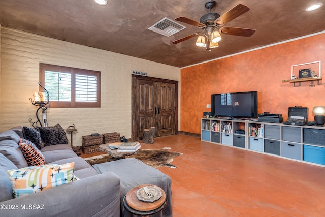 living area featuring concrete flooring, visible vents, recessed lighting, and a ceiling fan