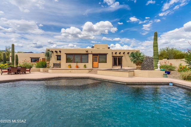 pool featuring a patio area