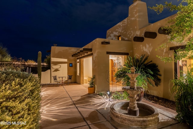 view of patio at night