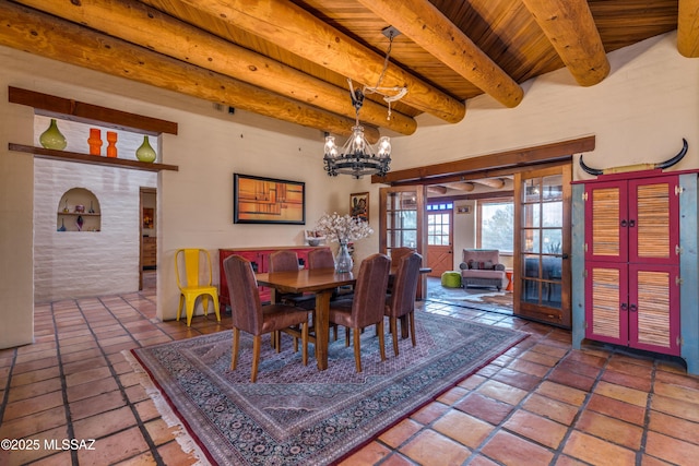 dining area with beamed ceiling, wood ceiling, french doors, and a chandelier
