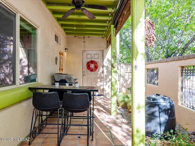 view of patio featuring ceiling fan and visible vents
